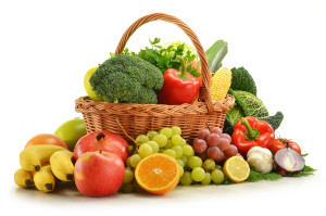 Composition with vegetables and fruits in wicker basket