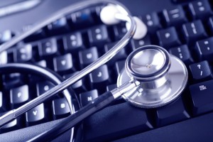 Stethoscope on a Computer Keyboard. Blue-toned.